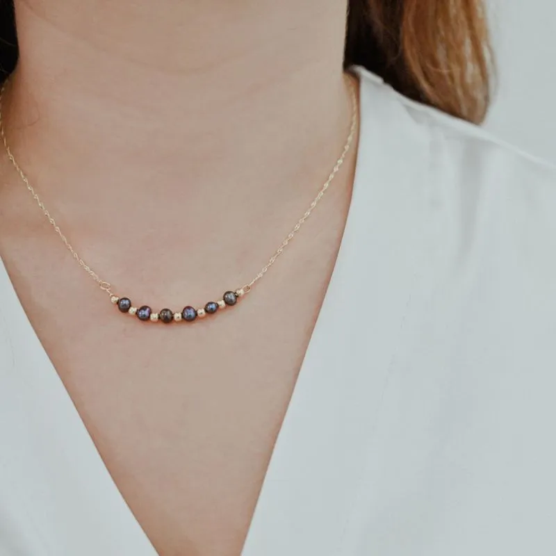 A 14 Carat Gold Chain With Black Pearl Beads Combined With 14 Carat Gold Beads