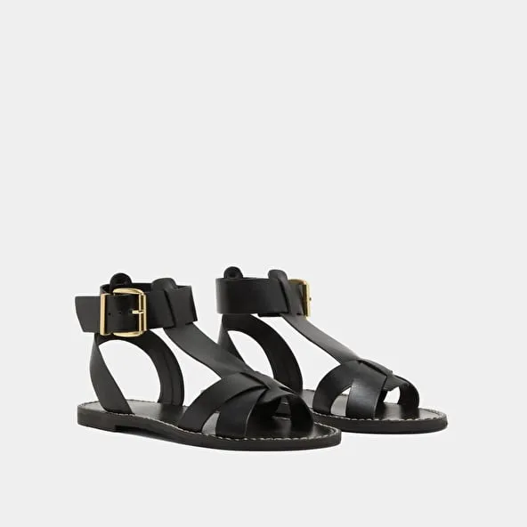 Buckle and strap sandals in black leather