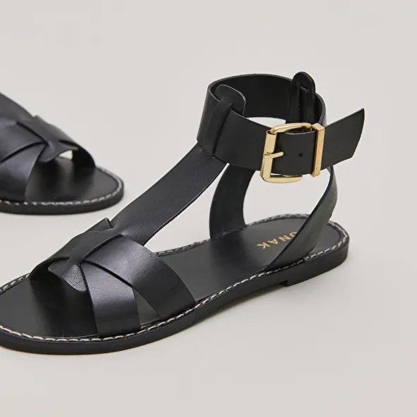 Buckle and strap sandals in black leather