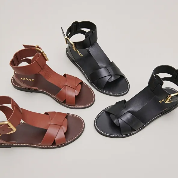 Buckle and strap sandals in black leather