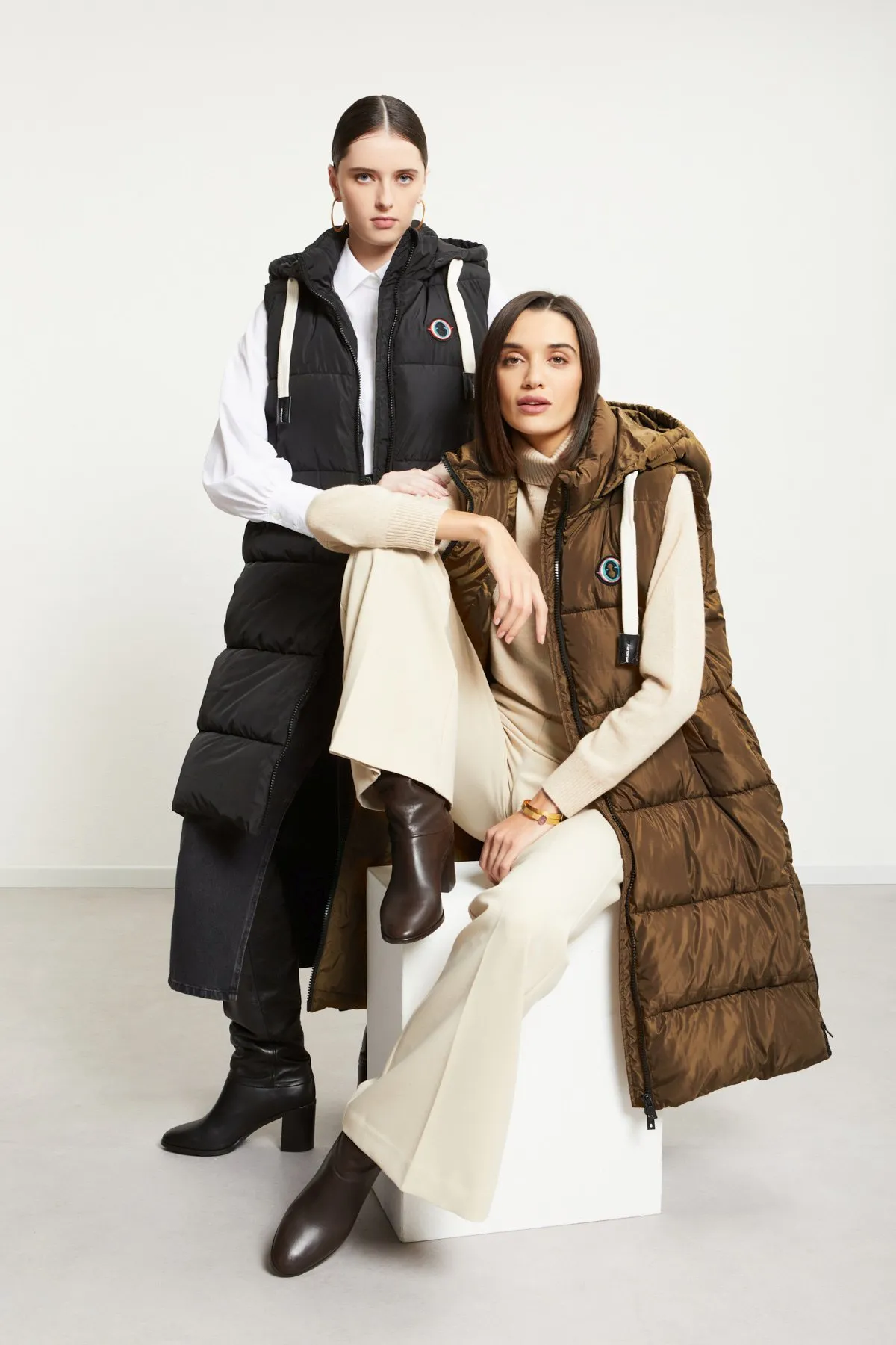 Sleeveless puffer midi jacket